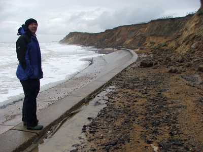 Man standing on a sea wall